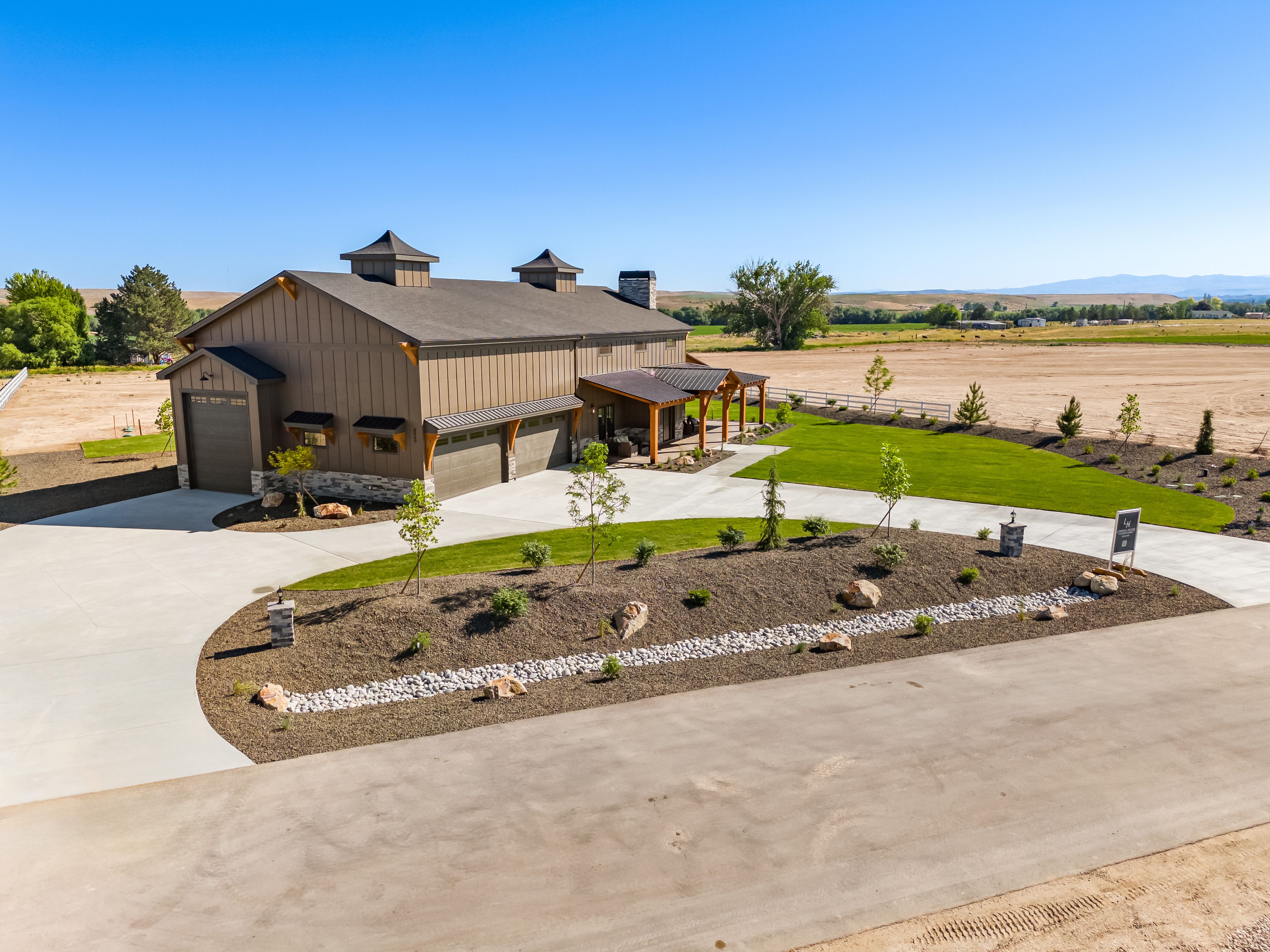 The Barn — drone view showing relationship to the main estate