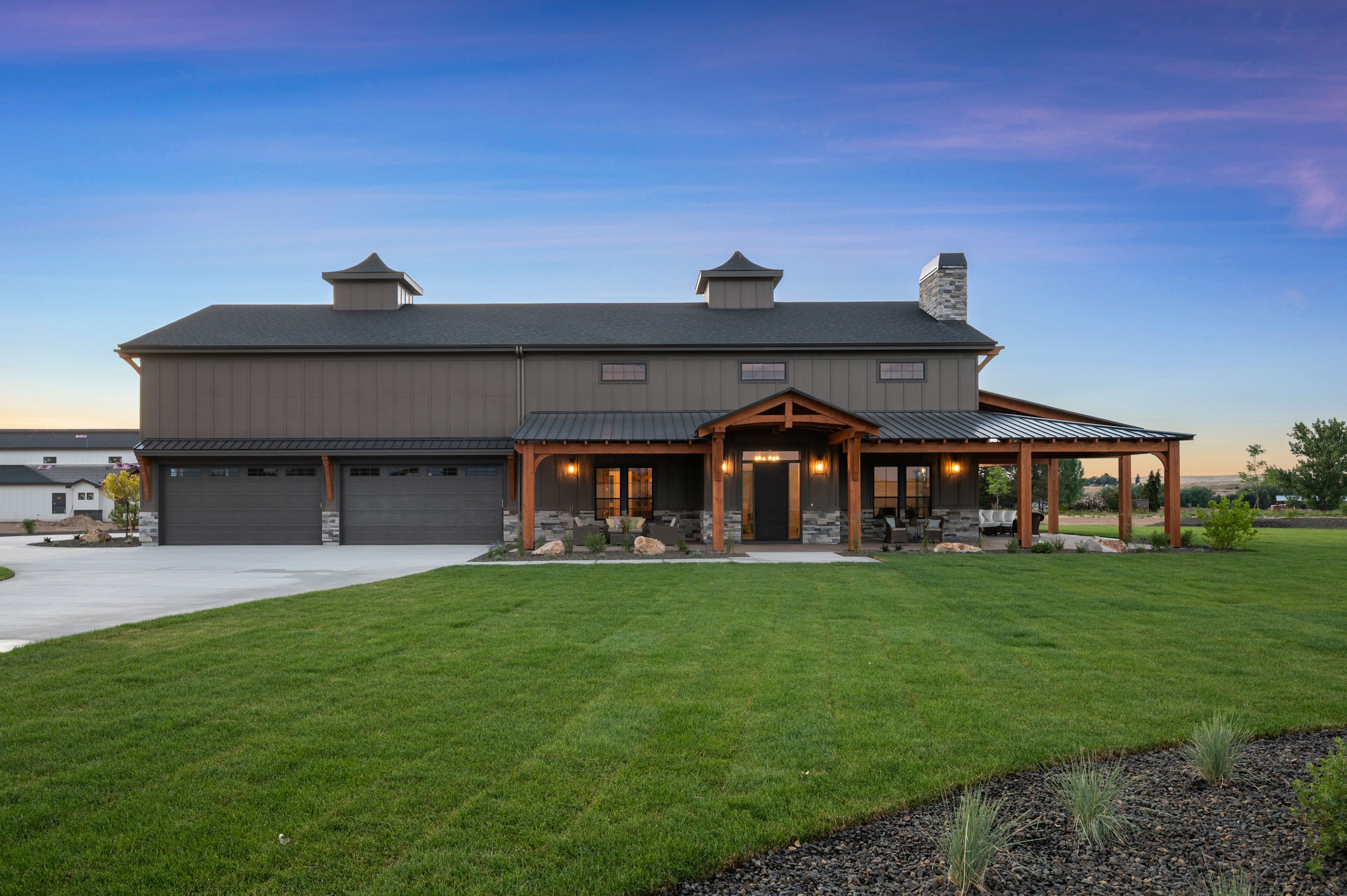 The Barn exterior at dusk — wide elevation view