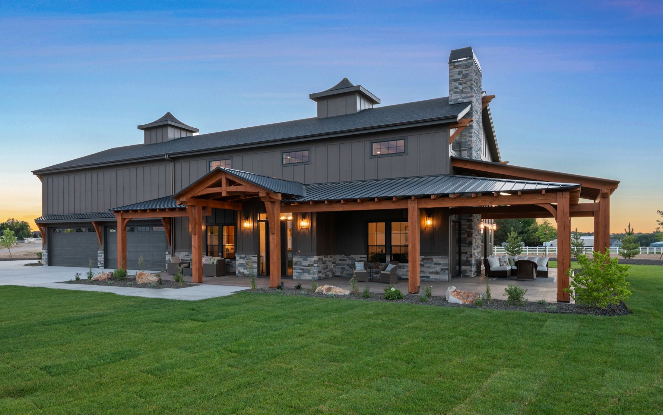 The Barn twilight detail — entry and facade lighting