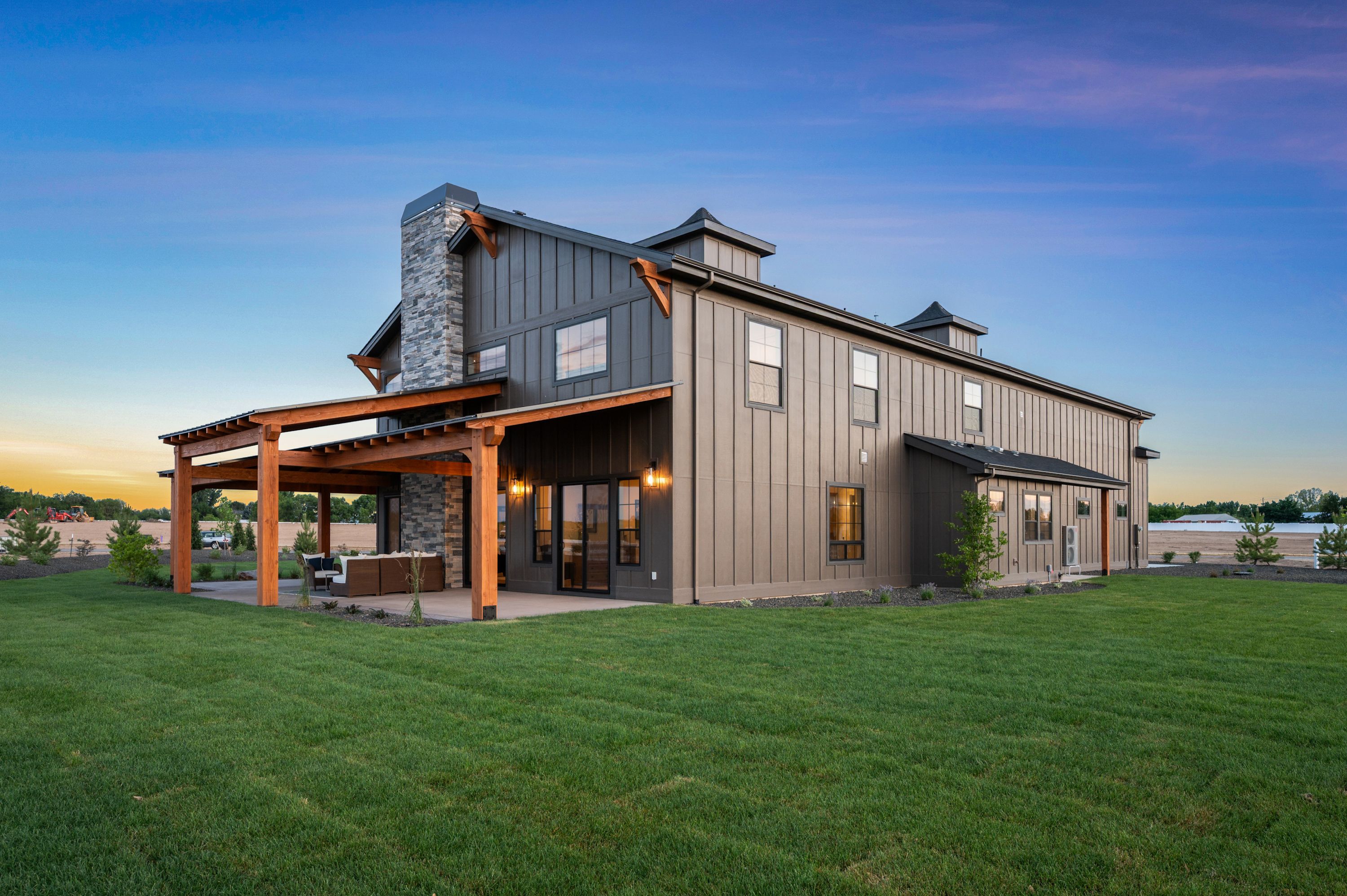 The Barn exterior at dusk — wide elevation view, Middleton Idaho