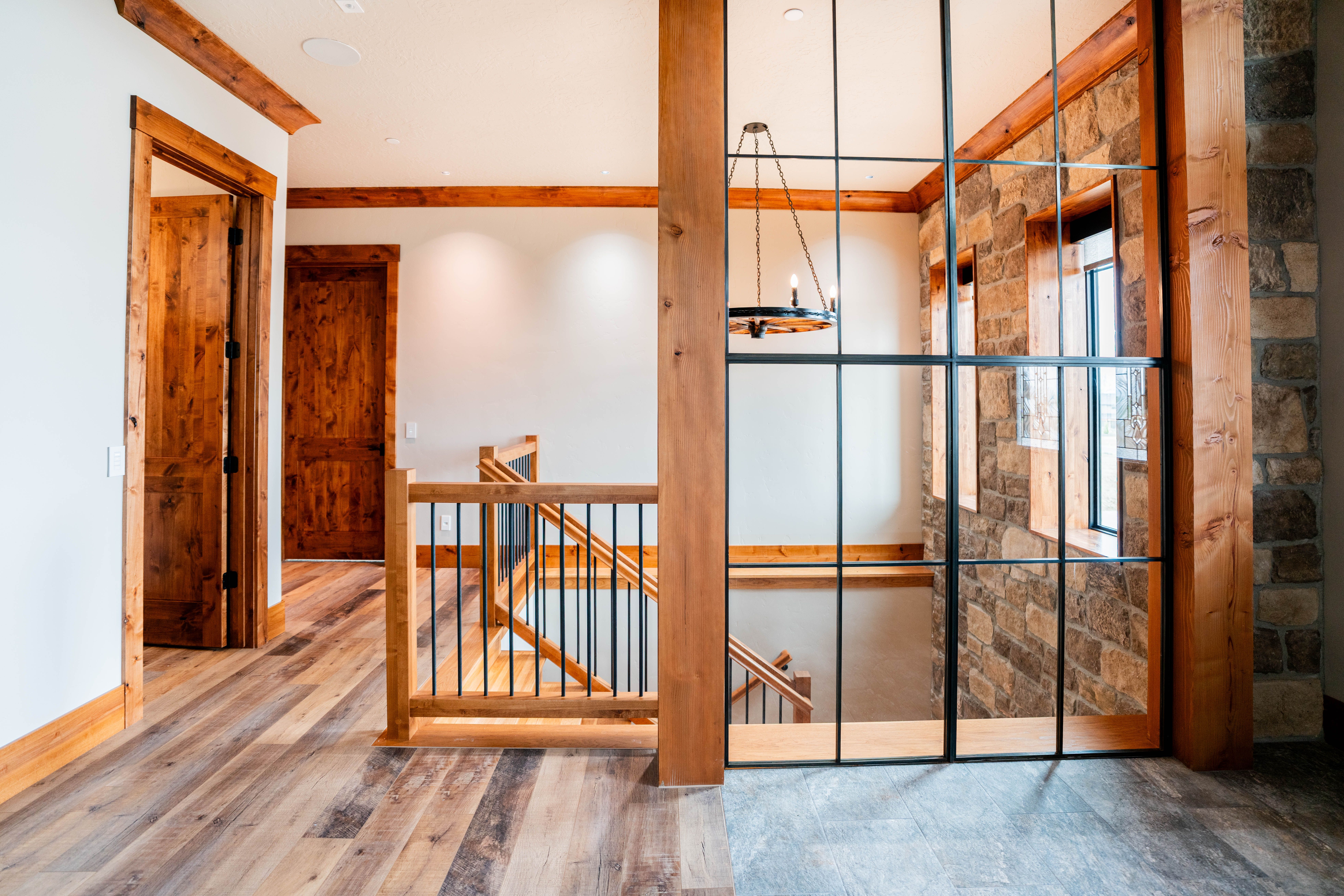 Hand-forged timber bridle in the Hawk Nest entryway — fabricated on site by Sawyer Rickman